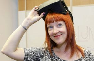 Robin Hunicke, with a VR headset pulled up
