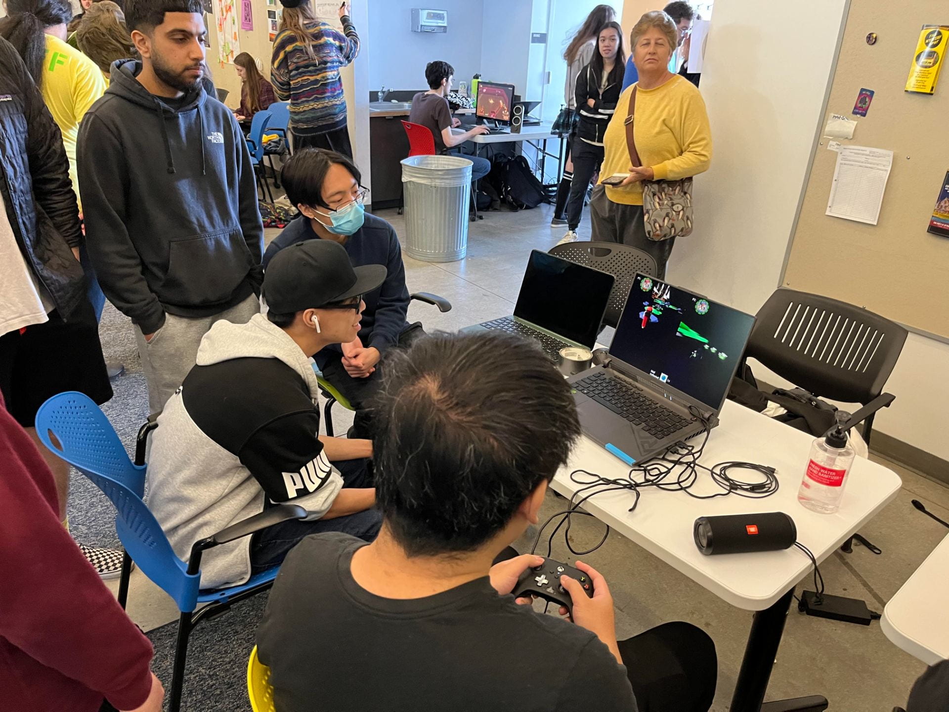 4 students playing a game at the UCSC games showcase